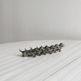 6 metal knife holders in the shape of small dogs