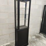 Old wooden window of black patina store two doors