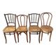 4 mismatched antique bistro chairs in wood and caning