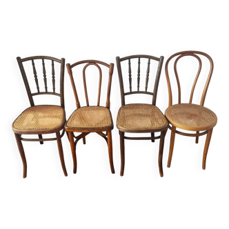 4 mismatched antique bistro chairs in wood and caning