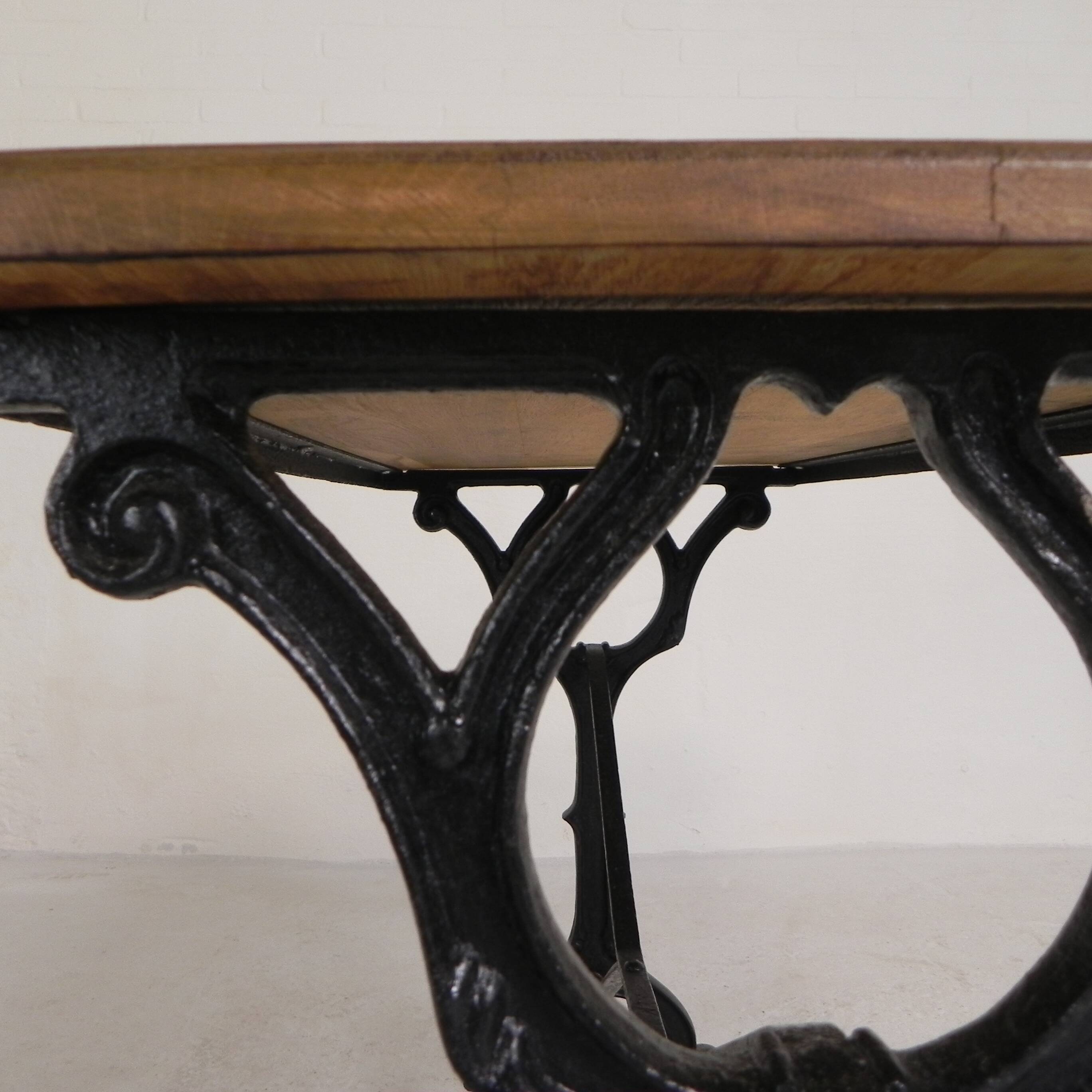 Bistro table with an oak top on a cast iron base, 1930s.