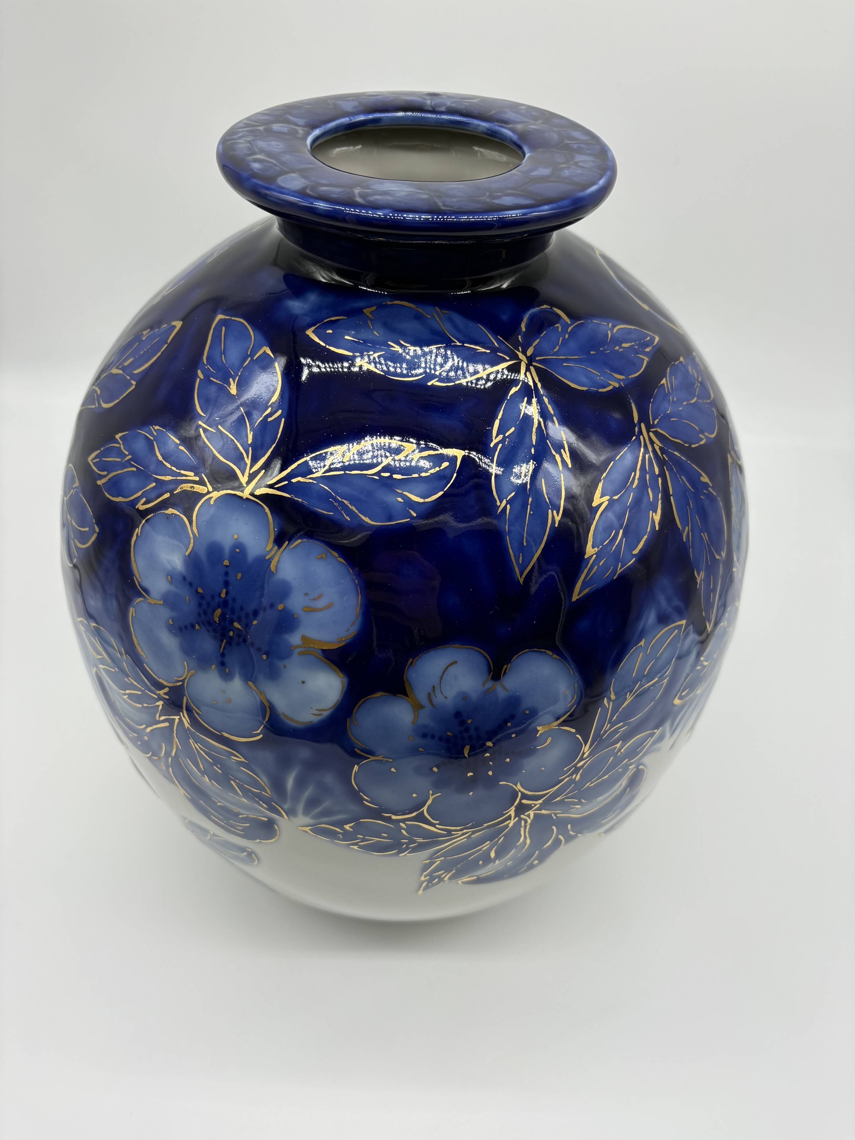 Large Tharaud Limoges vase in cobalt blue porcelain with floral decoration.