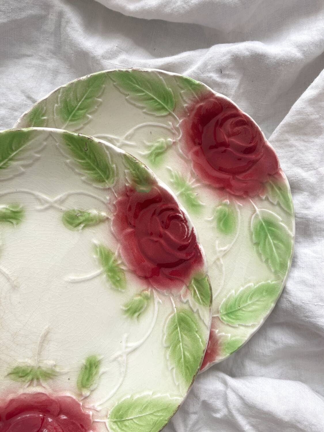 2 old slip plates decorated with roses