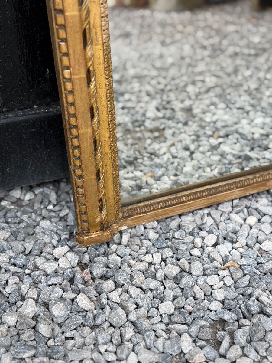 Louis XVI mirror in carved and gilded wood, 18th century