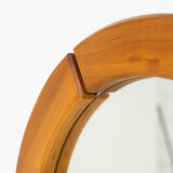 Sculptural wall mirror in solid pine