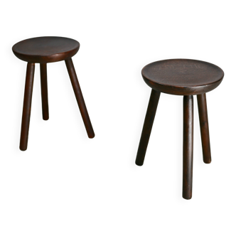 Pair of wooden tripod stools. France, circa 1960
