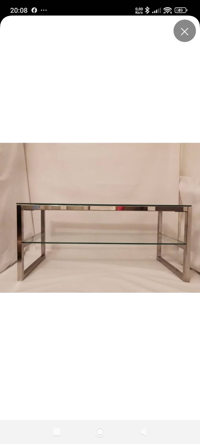 1980s coffee table with a double chrome metal top.