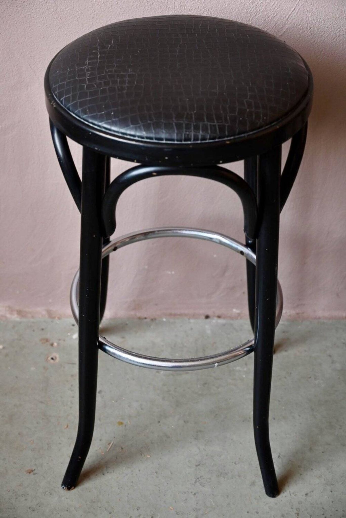Pair of 1960s bistro bar stools in black and chrome with vinyl shell.