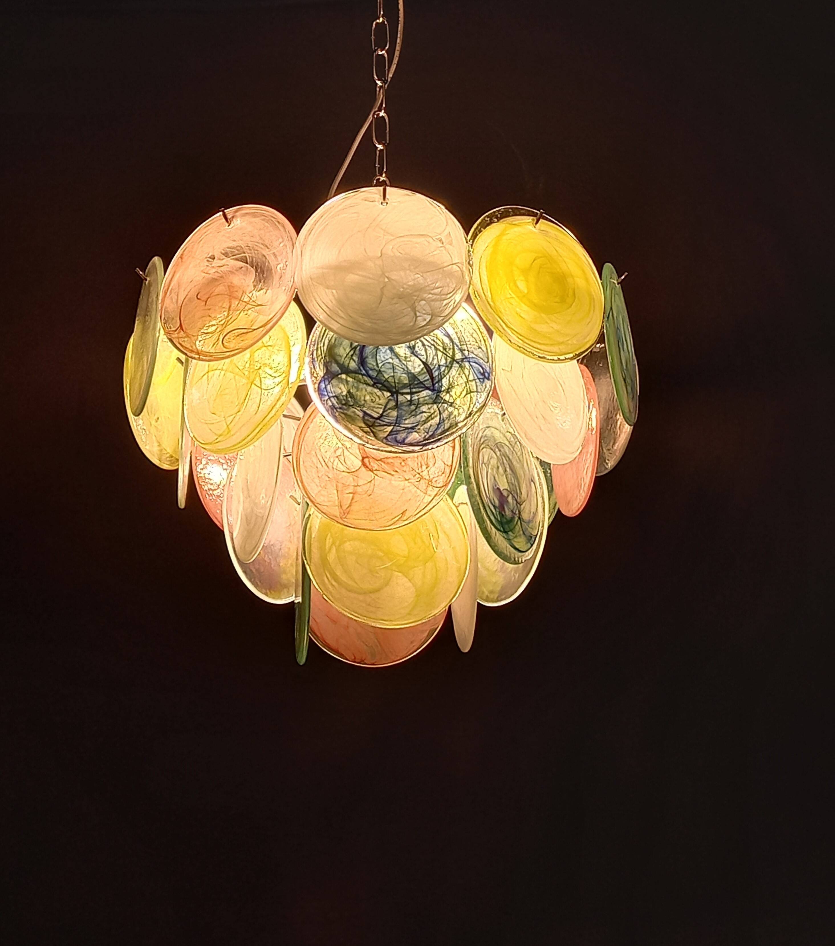 Handcrafted chandelier with Murano glass discs.