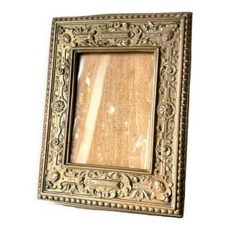Antique brass metal picture frame in baroque style
