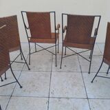 3 chaises et 2 fauteuils en fer forgé et rotin canné, années 50