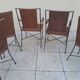 3 chairs and 2 armchairs in wrought iron and caned rattan, 1950s.