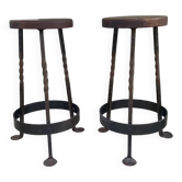 Pair of wrought iron and oak bar stools
