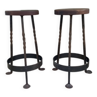 Pair of wrought iron and oak bar stools