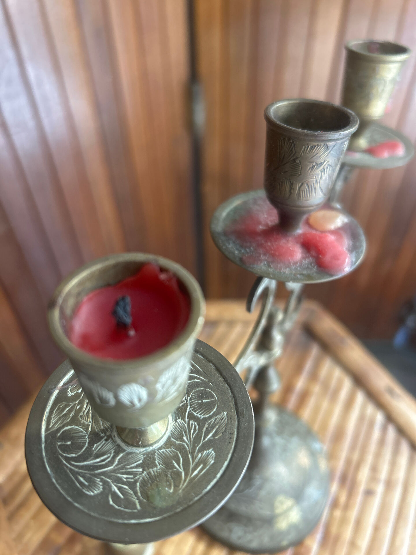 Vintage brass candelabrum engraved with three lights and a snuffer.