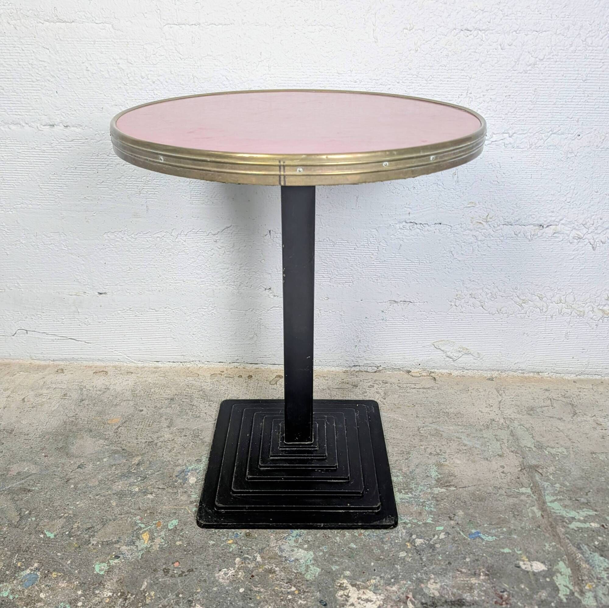 Pink and brass bistro table, Art Deco pyramidal base.
