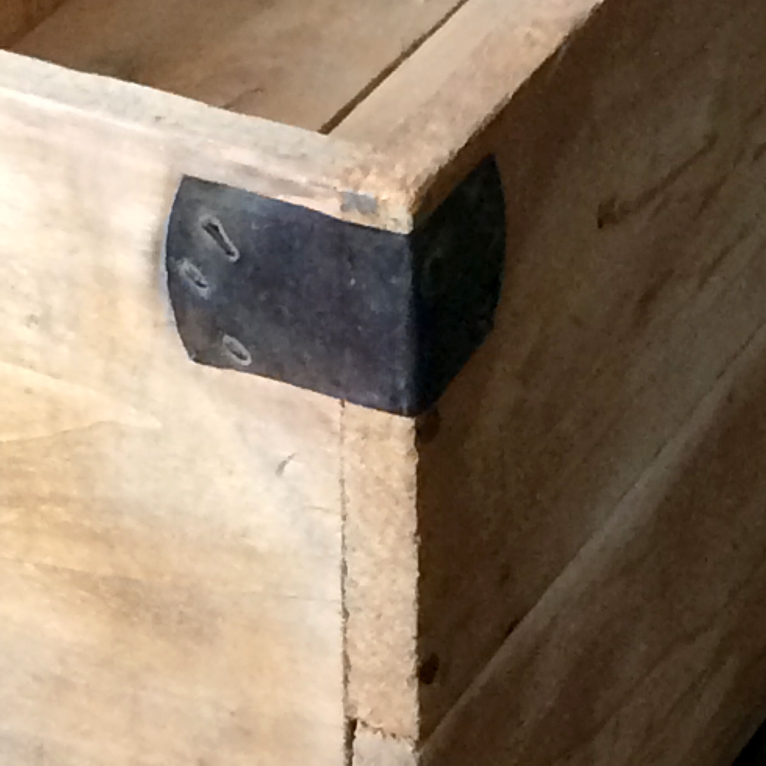 Wooden crate with metal fittings