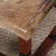 Tabouret en bois massif et peau, travail du XXe siècle