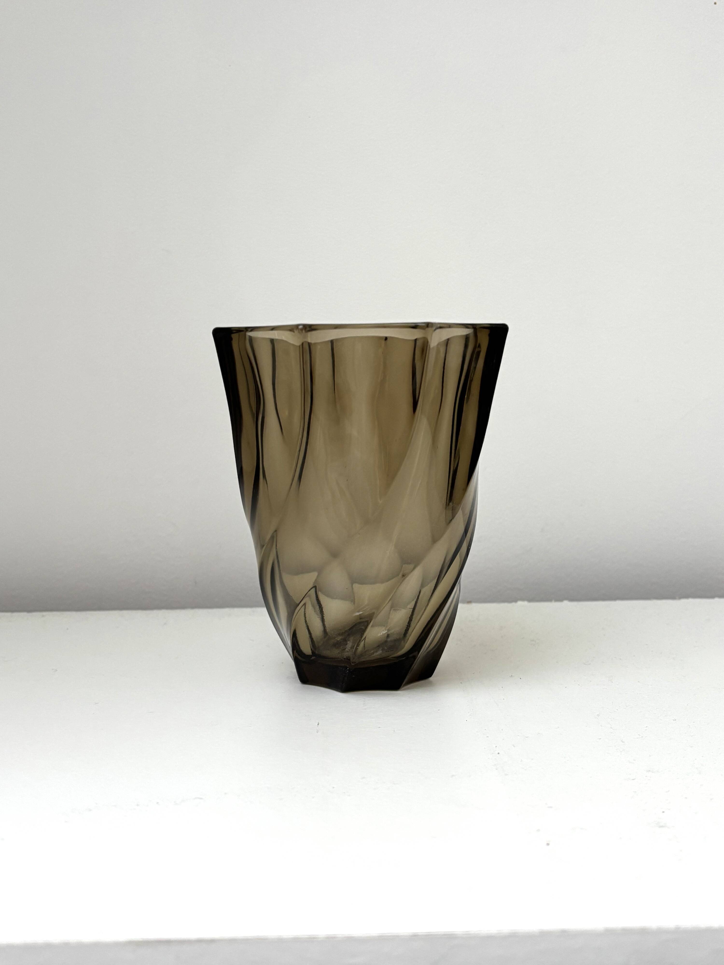 Small translucent dark brown twisted glass vase