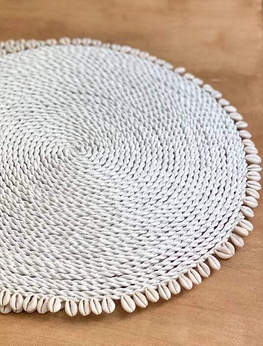 Large woven vegetable fiber placemat decorated with shells cowrie shells Bali