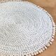 Large woven vegetable fiber placemat decorated with shells cowrie shells Bali