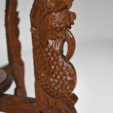 Asian coffee table carved with dragons and peacocks, Indonesia, early 20th century