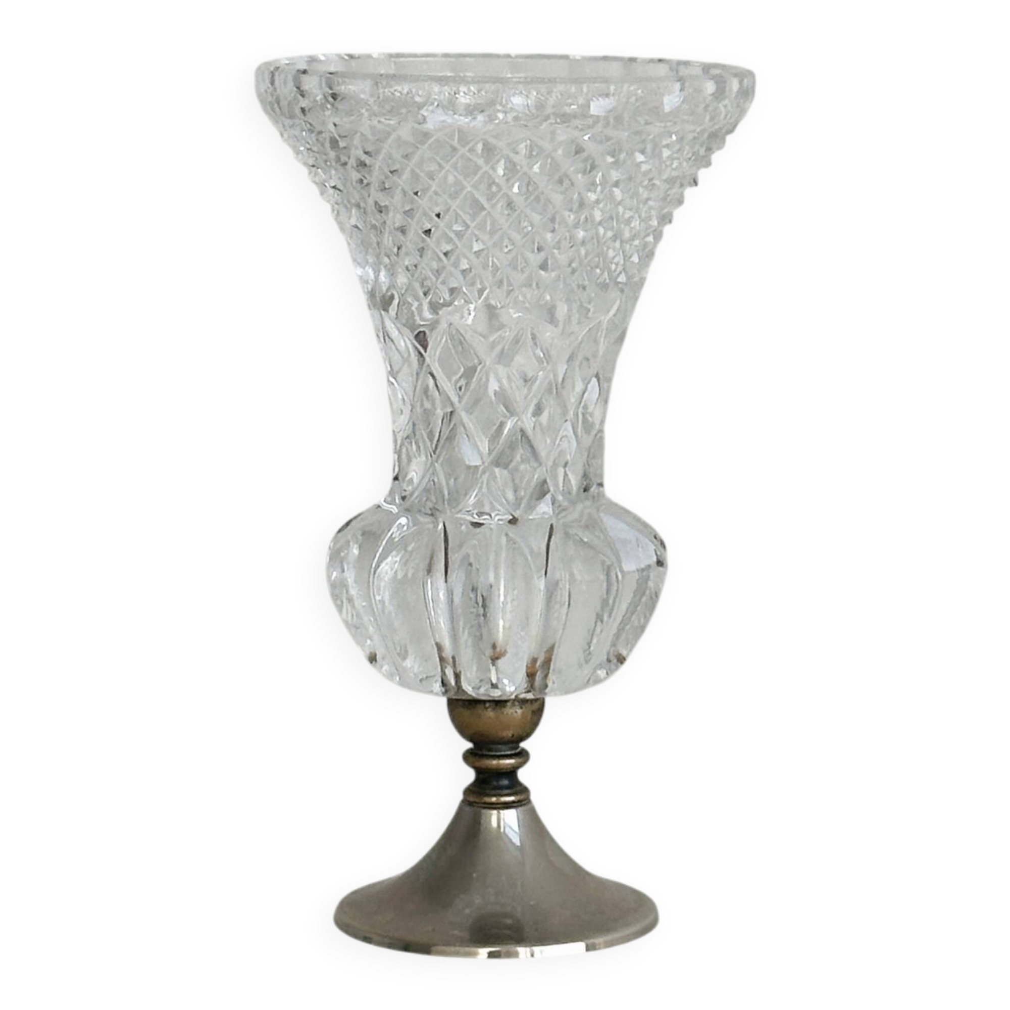 Small vase on a metal stand with thick glass.