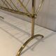 Brass and wood magazine rack, in the style of Cesare Lacca.