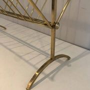 Brass and wood magazine rack, in the style of Cesare Lacca.