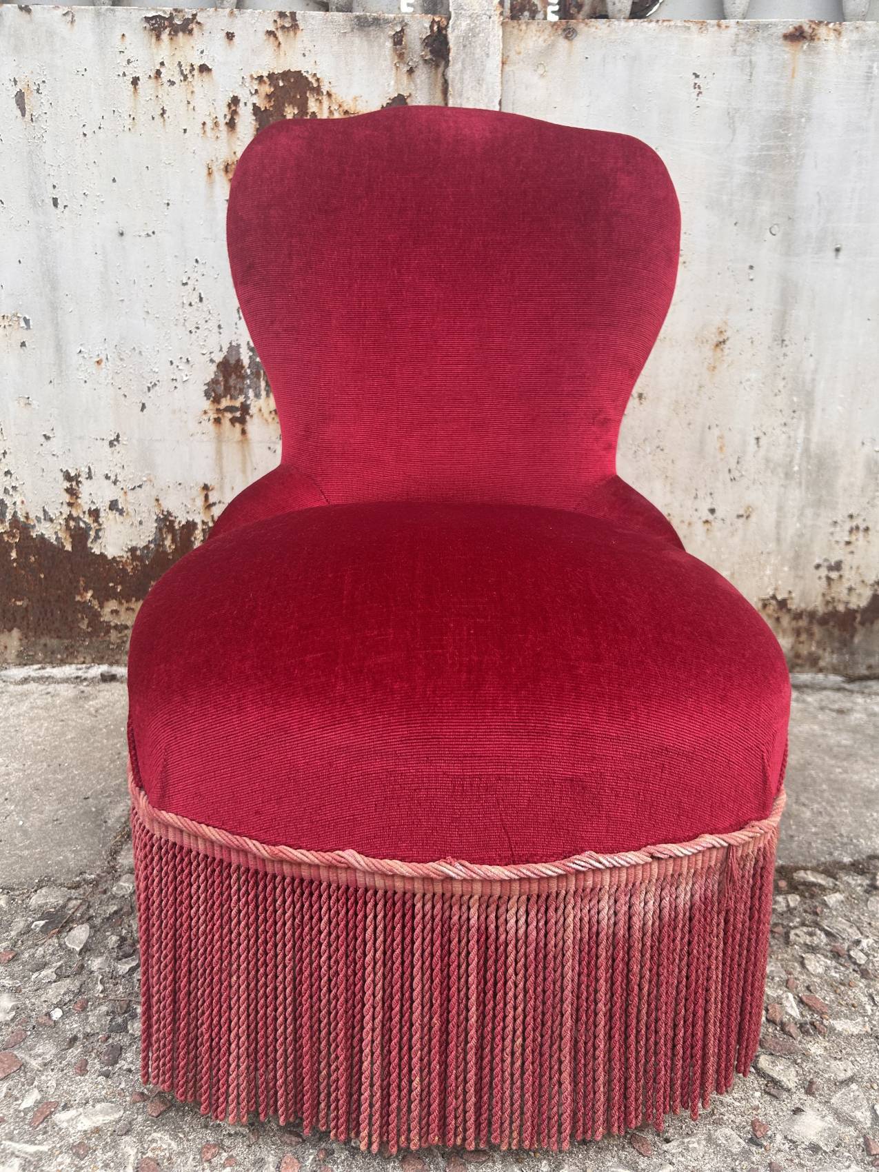 Vintage burgundy velvet armchair with fringes – theatrical and elegant