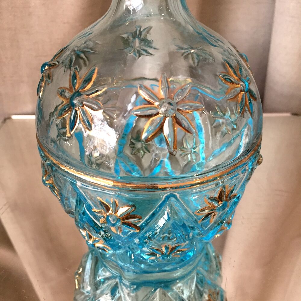 Turquoise blue liquor decanter and glass gild mold press of the 1950s