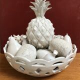 Trompe l'oeil fruit cut in white earthenware by Jean Roger, circa 1960.