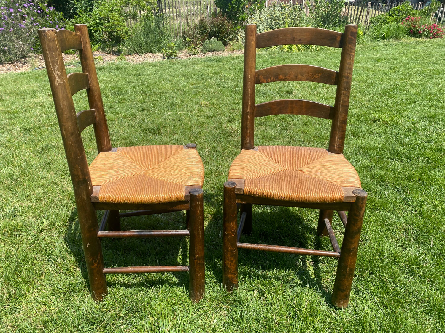 Pair of Georges Robert straw chairs