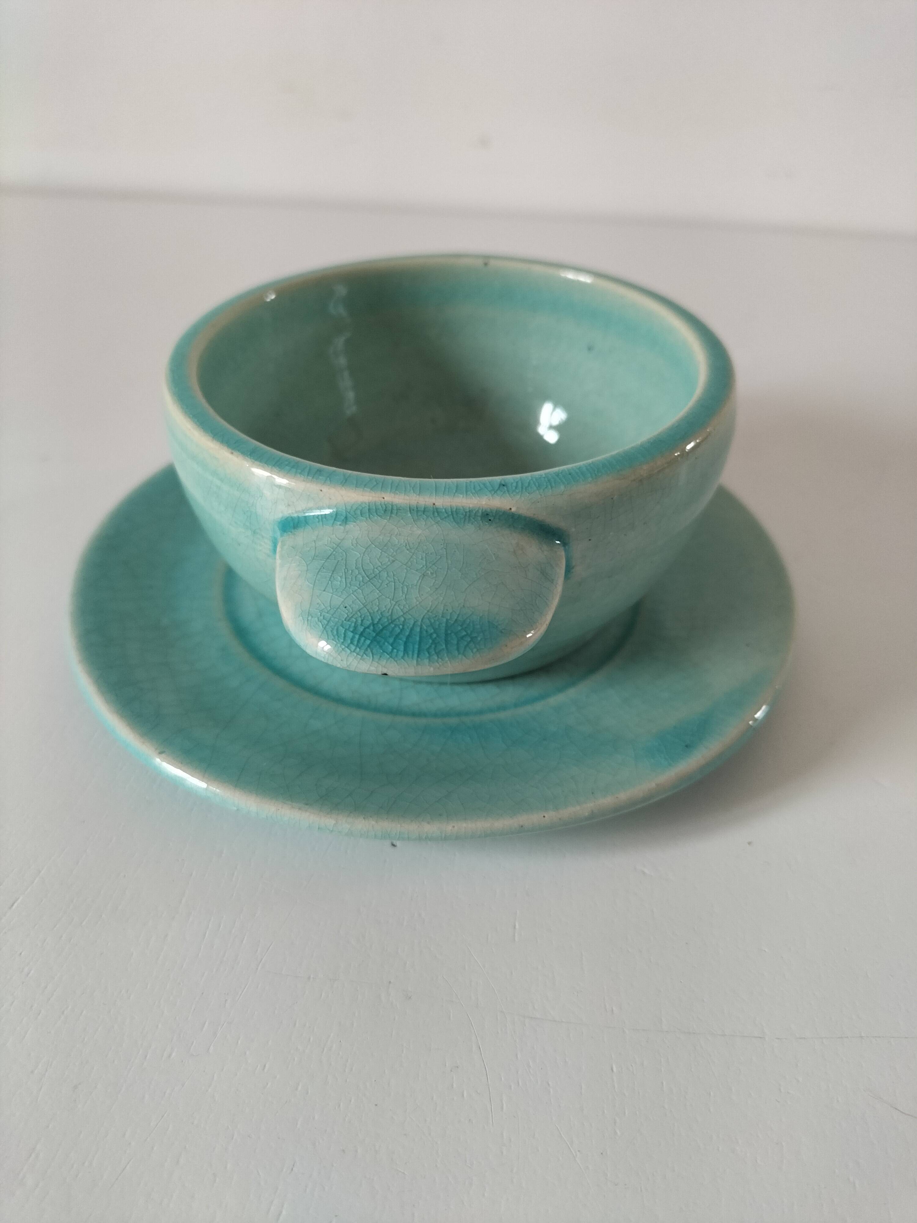 Earthenware bowl and saucer in glazed water green ceramic.