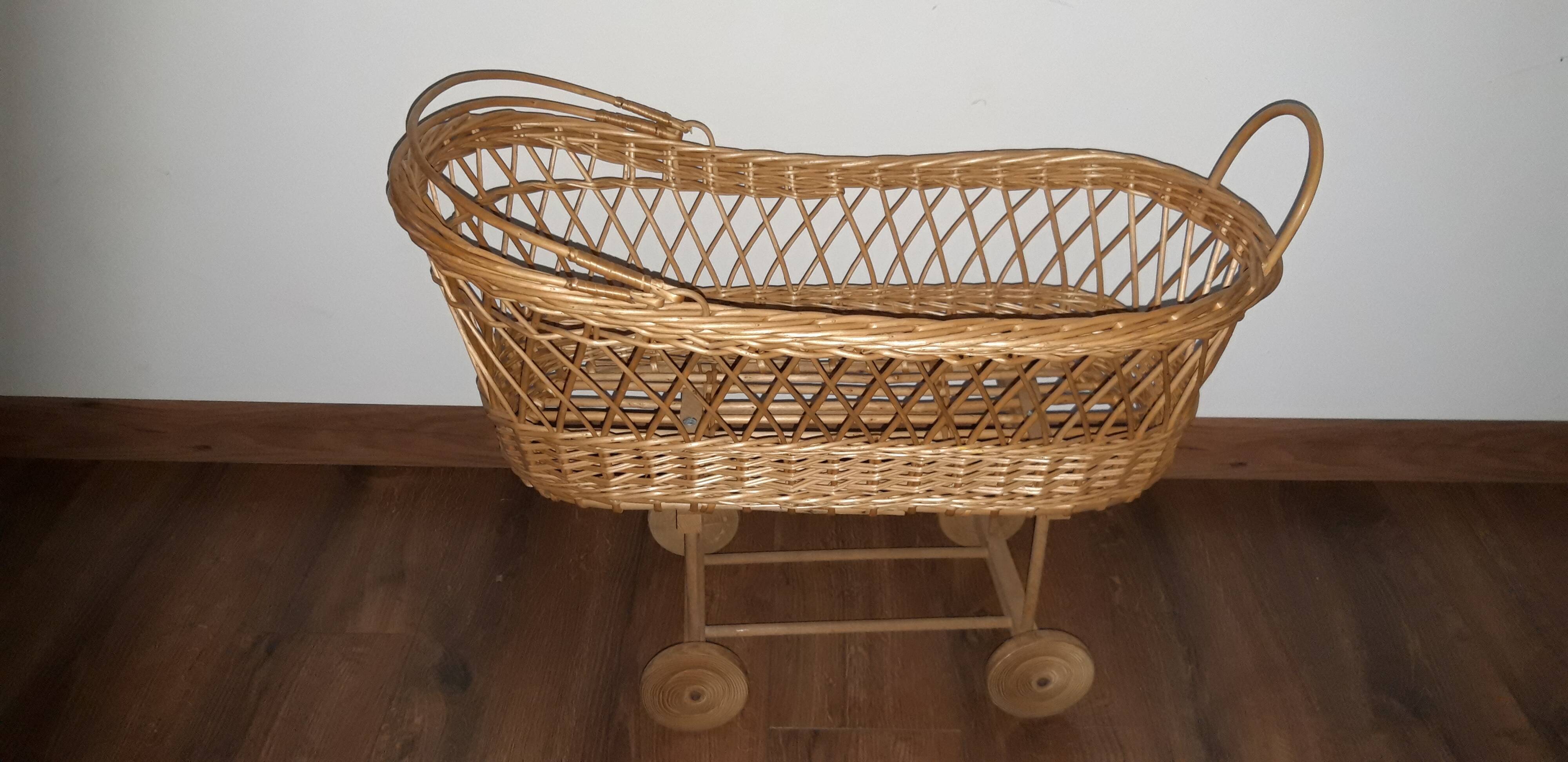 Vintage wicker cradle with wheels