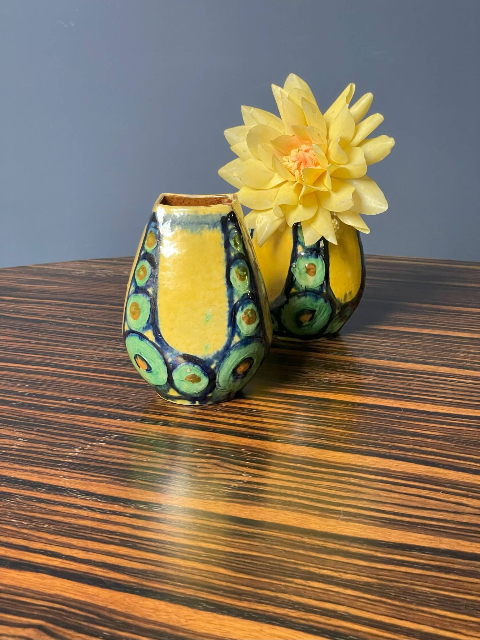 A pair of green and yellow vases