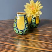 A pair of green and yellow vases