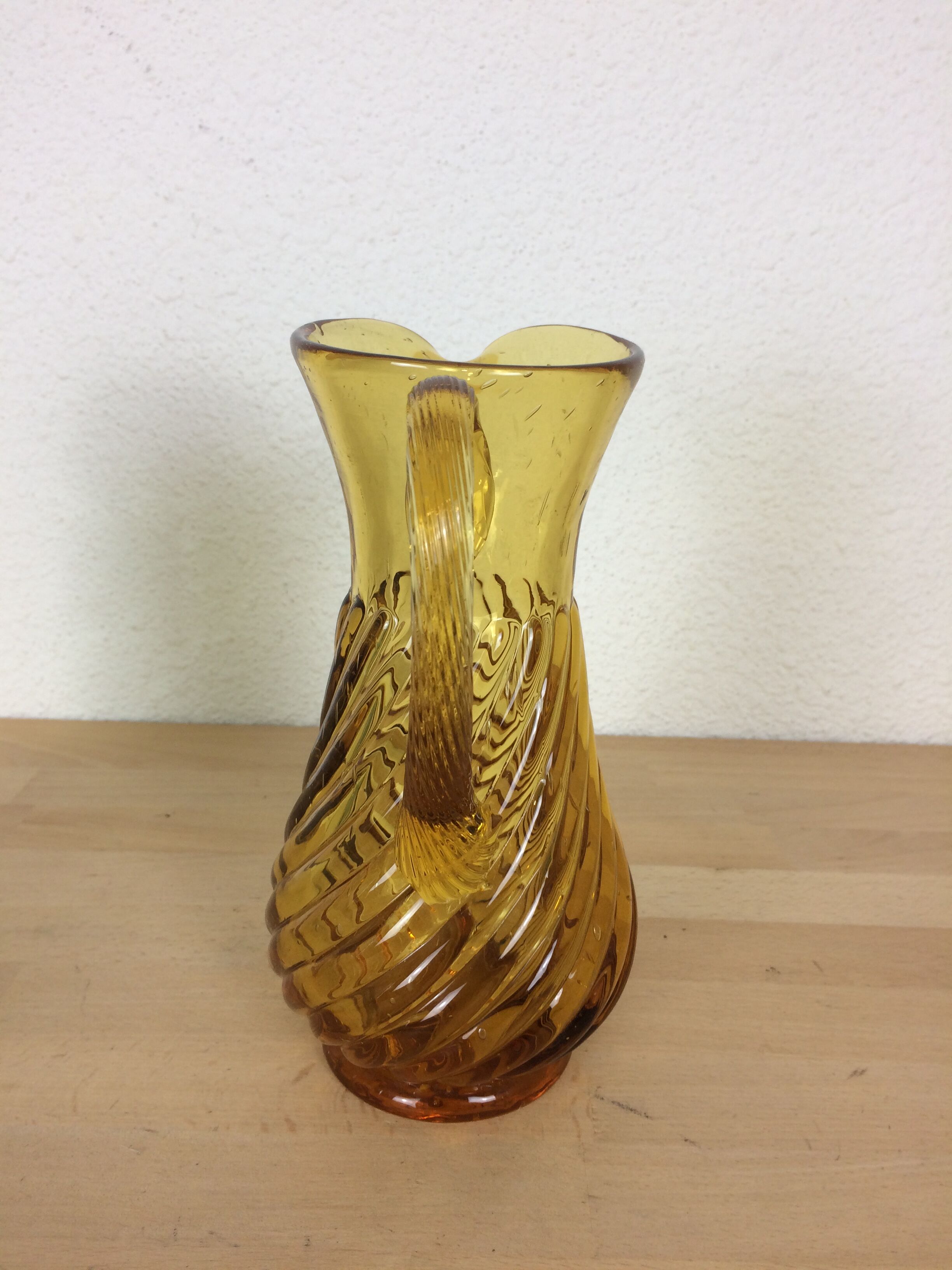 Twisted amber glass pitcher