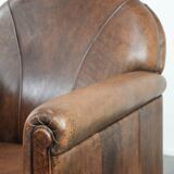 Vintage sheepskin armchair with warm colours and a characterful appearance