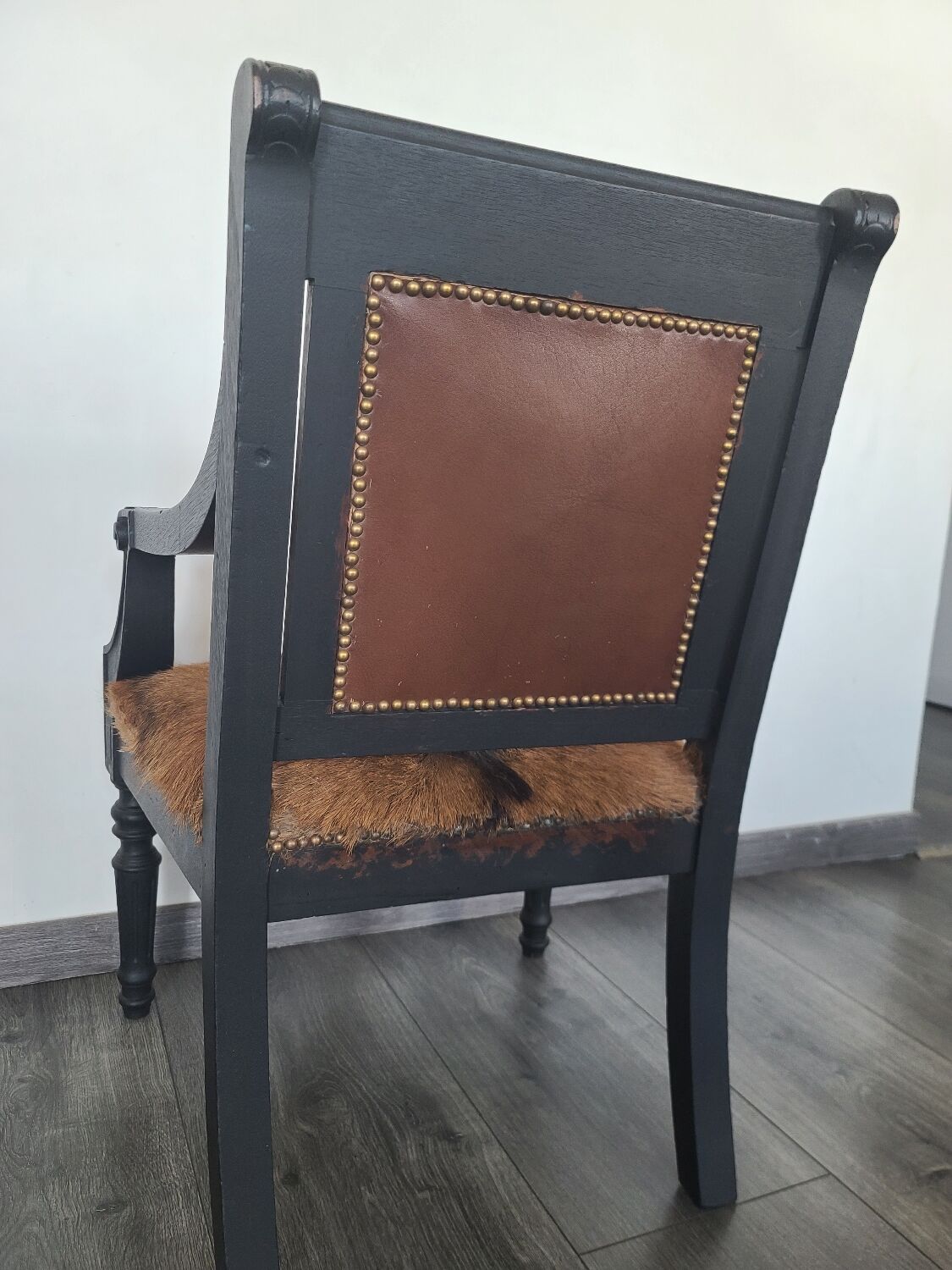 Character armchair in black wood and animal skin #CHMR