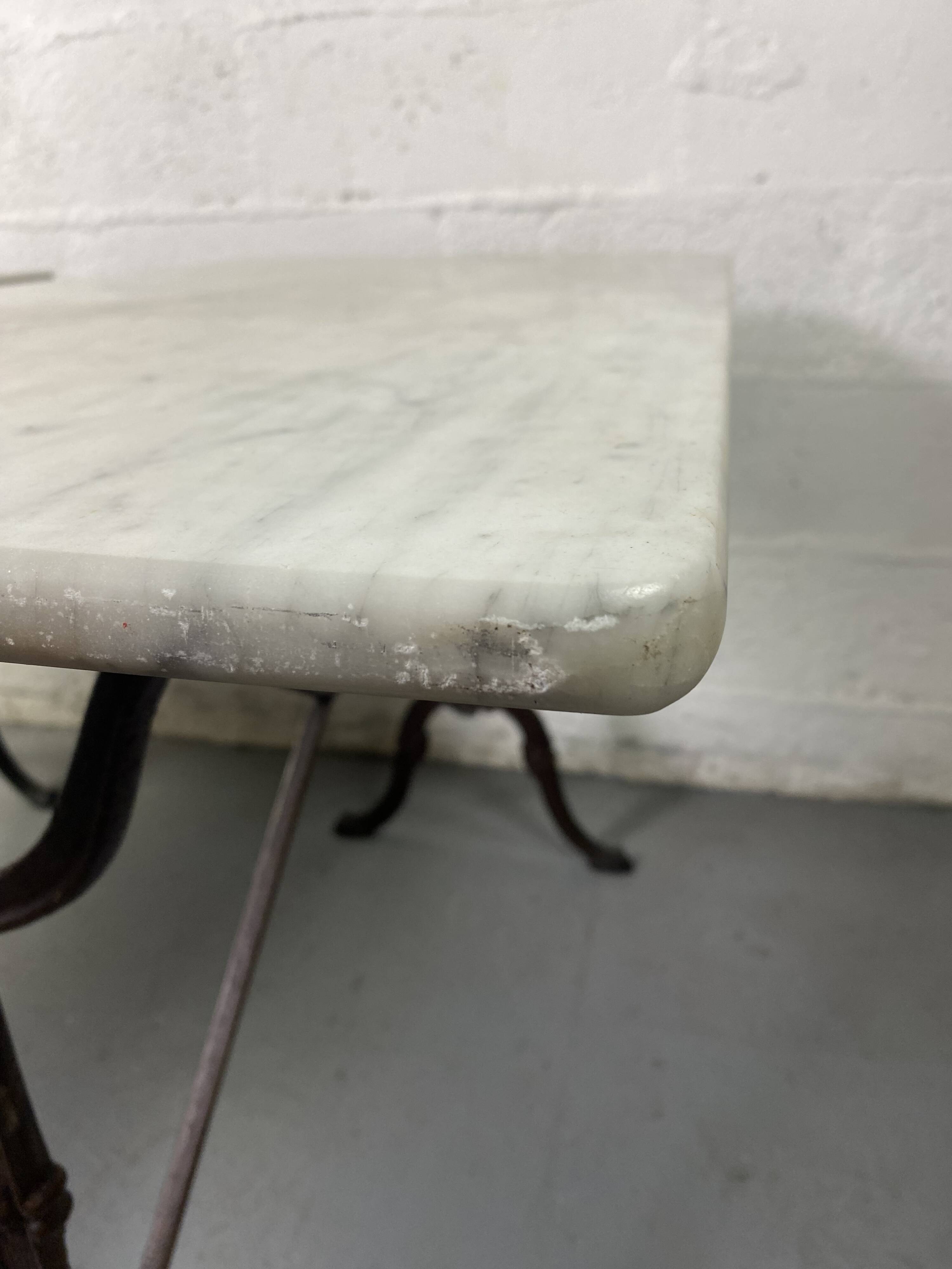 Set of two bistro tables in marble and wrought iron