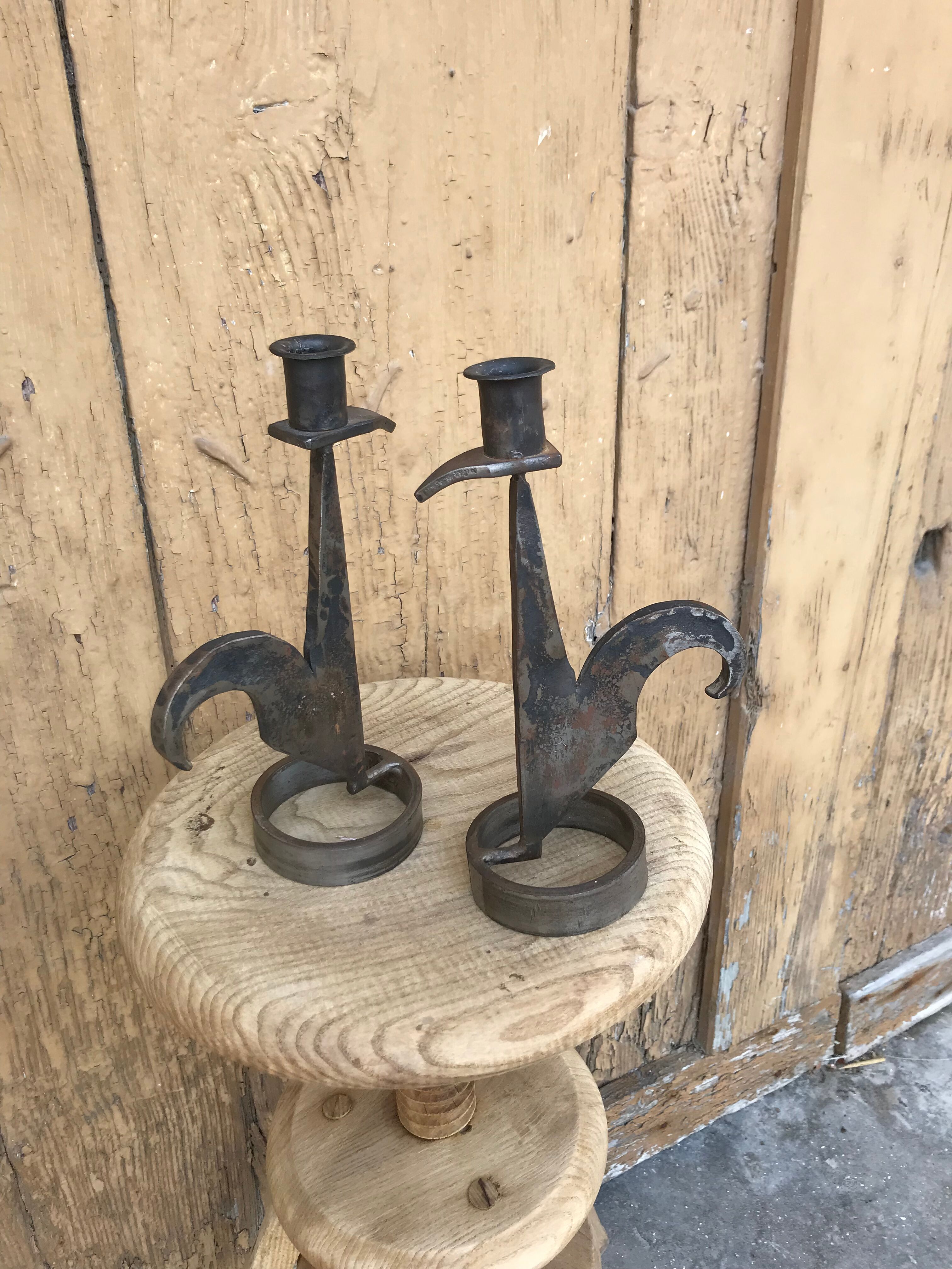 Signed zoomorphic iron candle holders