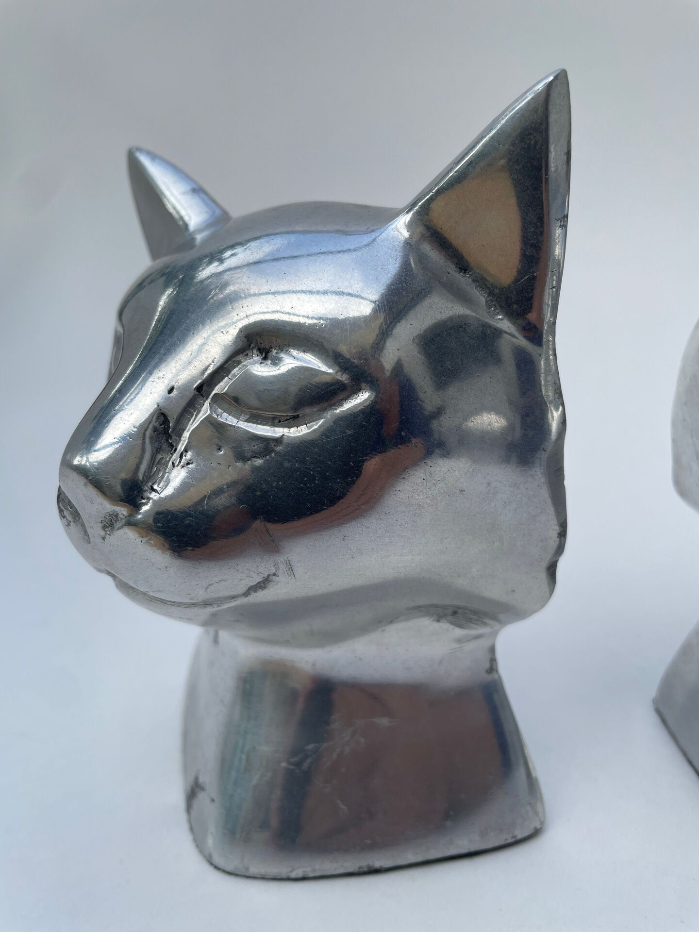 Pair of designer cat head bookends