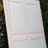 Pair of cupboard doors and old woodwork frame