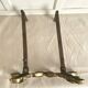 Pair of brass and cast iron fire dogs