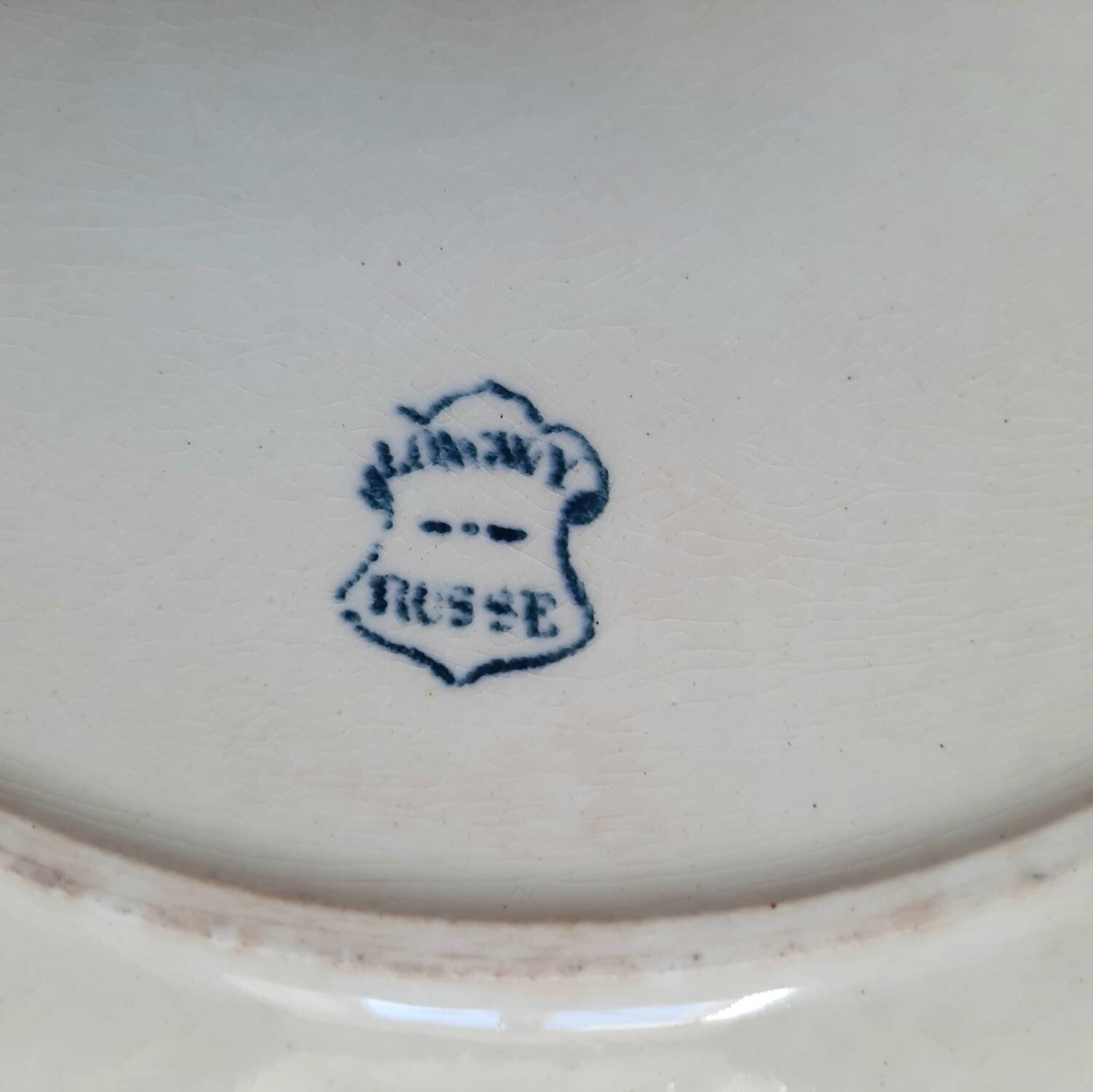 Old mismatched dinner plates accompanied by a dish