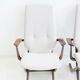 Pair of varnished wooden reclining armchairs, upholstered in lightweight fabric.