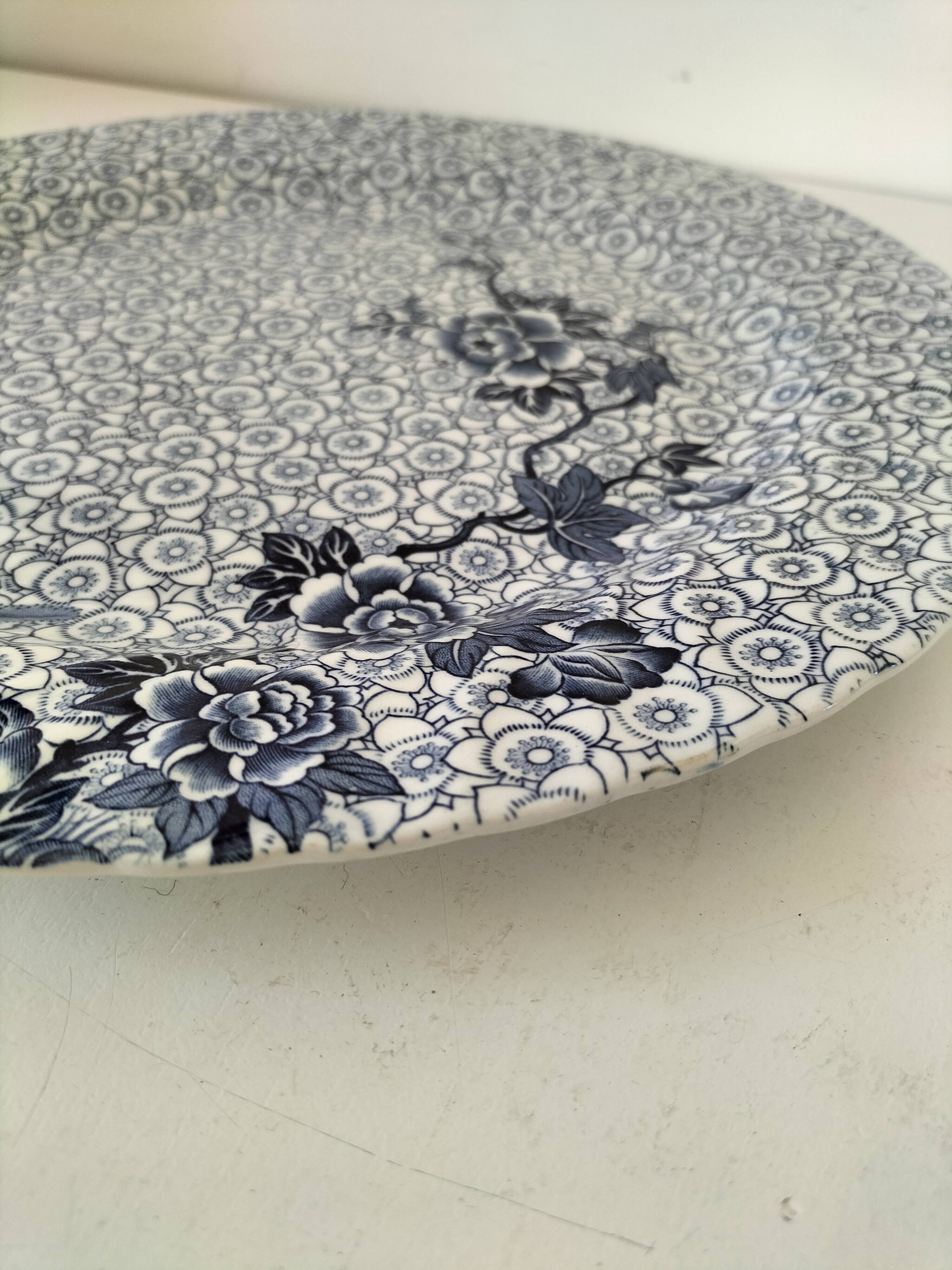 Round antique plate by Johnson Brothers in the Blue Lotus pattern.
