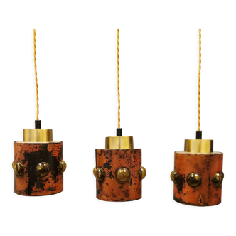 3 lamps made of copper, brass and glass.