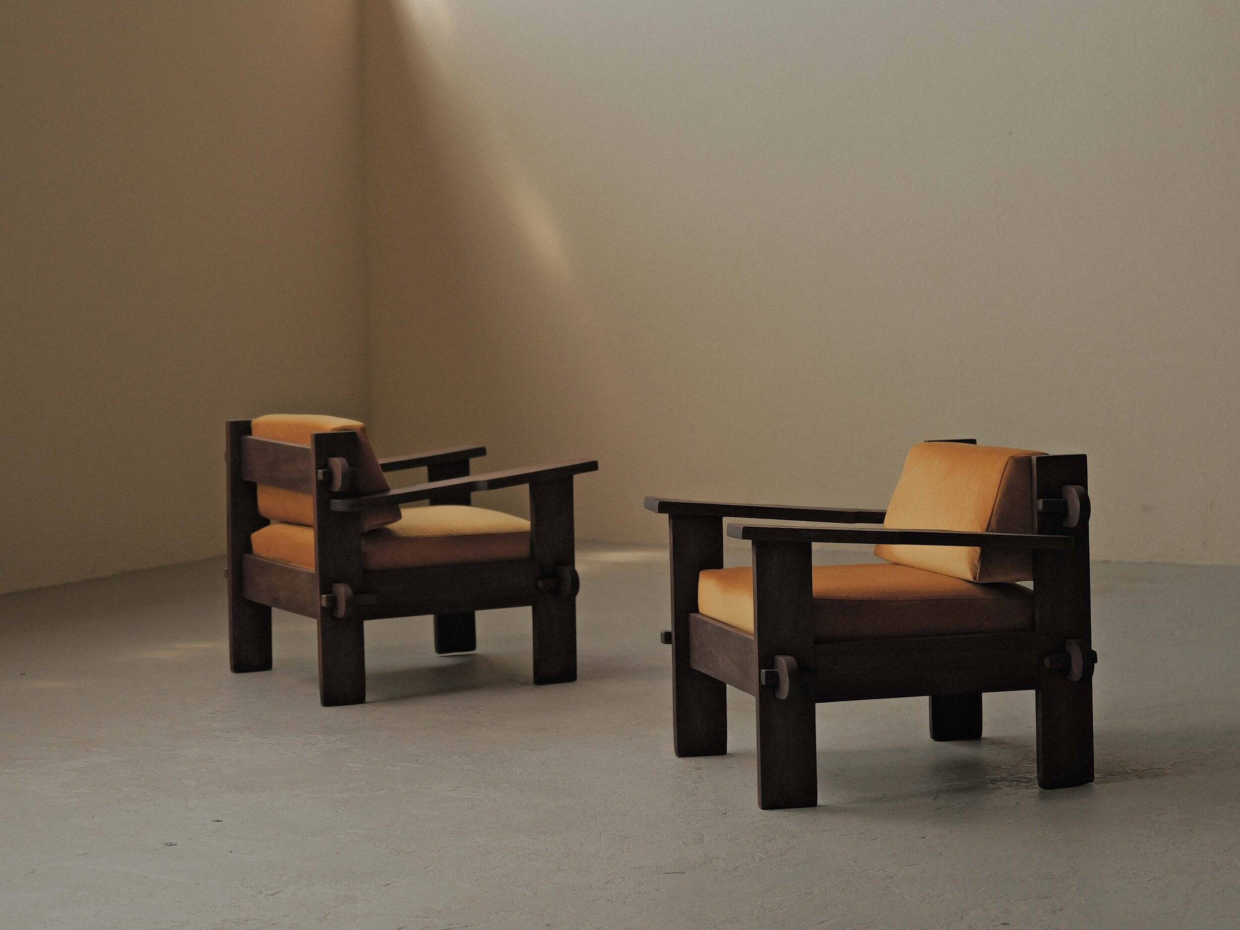 Pair of architect's armchairs in solid wood, France, circa 1970.